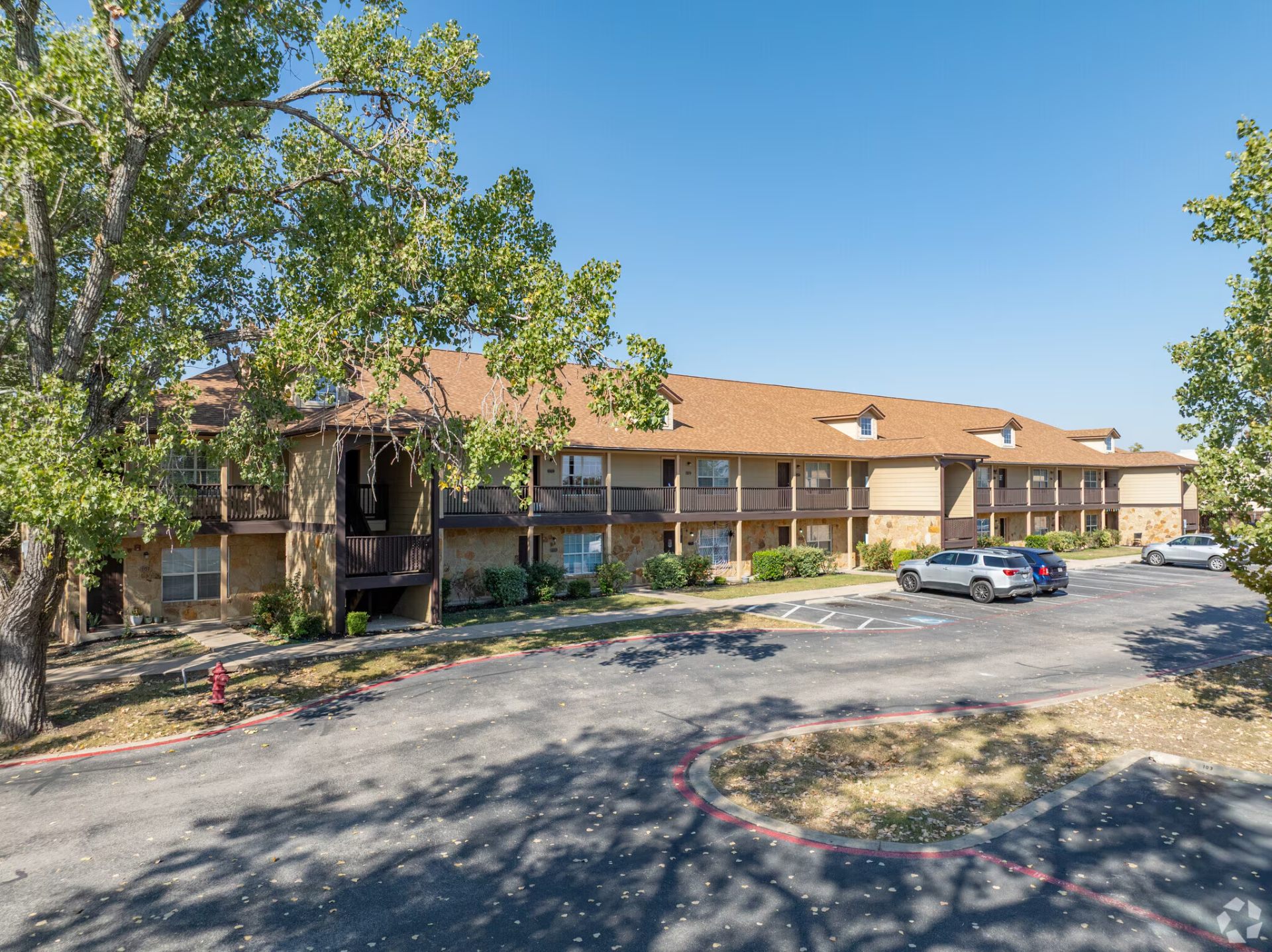 Wide view of the Montierra Ranch front buildings and parking area