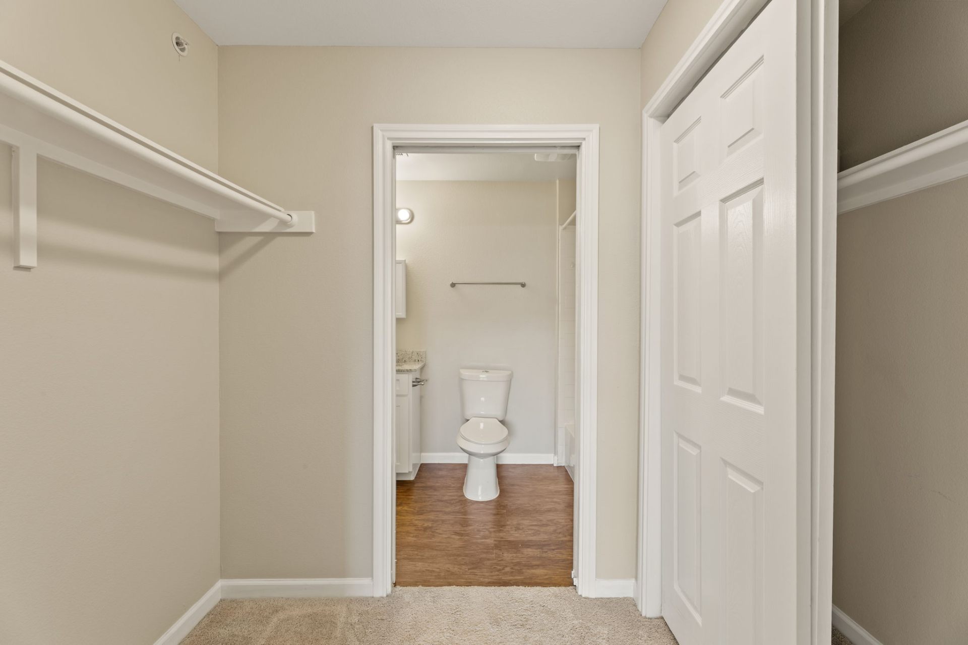 Walk-in closet leading to the en-suite bathroom